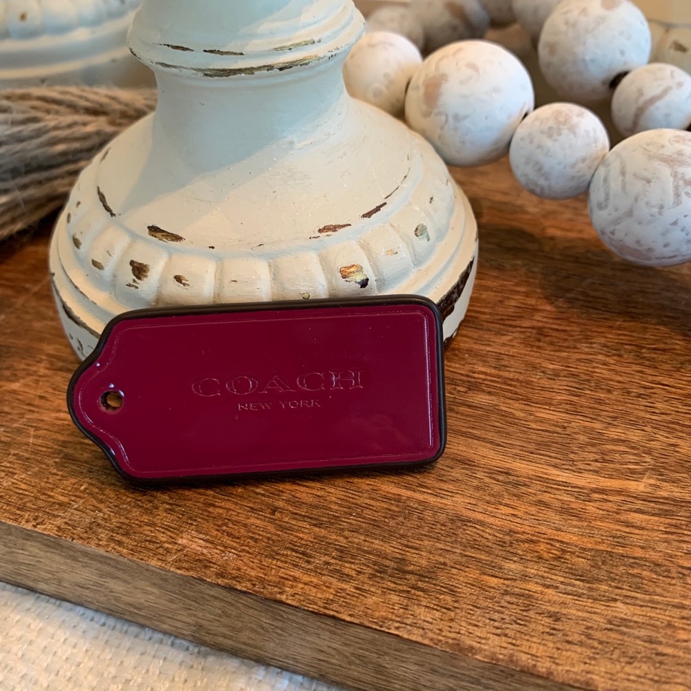 Coach purple leather hang tag